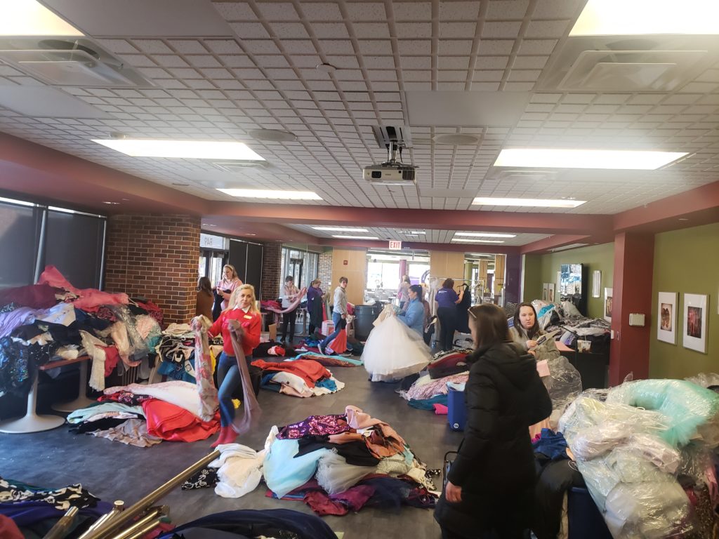 Volunteers sorting dresses at MCC in 2023